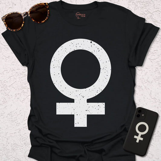 A black t-shirt with a large Woman or Venus Symbol in grunge style