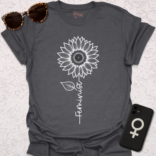 Grey t-shirt with minimalist sunflower graphic and the word feminist as the stem